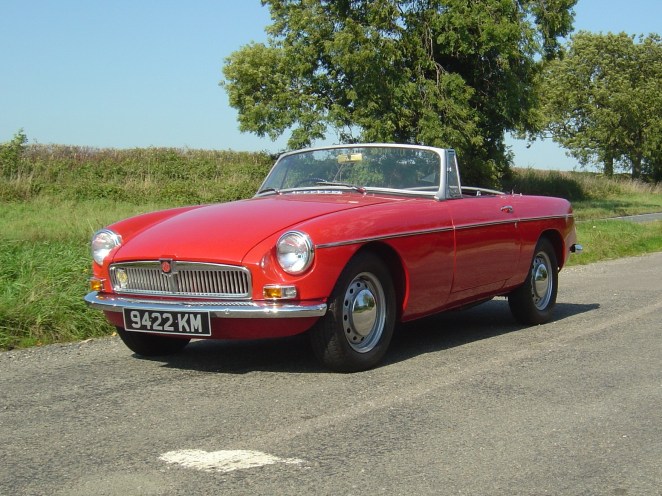 Yes, a red MGB. Big wows. Oh, hold on. It's an early one!