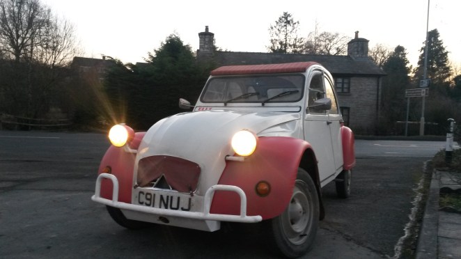 A filthy Elly pauses on the way home.